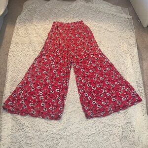 URBAN OUTFITTERS: Palazzo pants in red floral print. Size M. 35" leg opening.